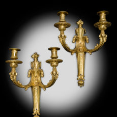 A PAIR OF LATE LOUIS XV GILT-BRONZE TWO‐LIGHT WALL‐LIGHTS