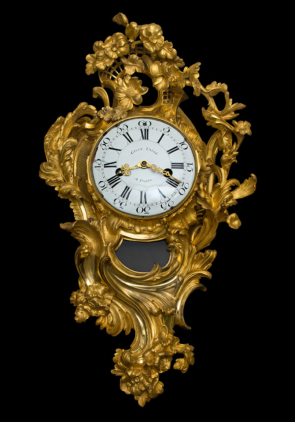 A Louis XV ormolu cartel clock.